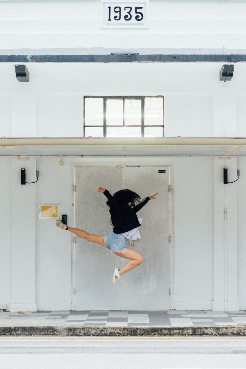 dance pose, full length, one person, feminism, building exterior, mid-air, mammal, front, architecture, white, dance, near, dancing, pets, nature, room