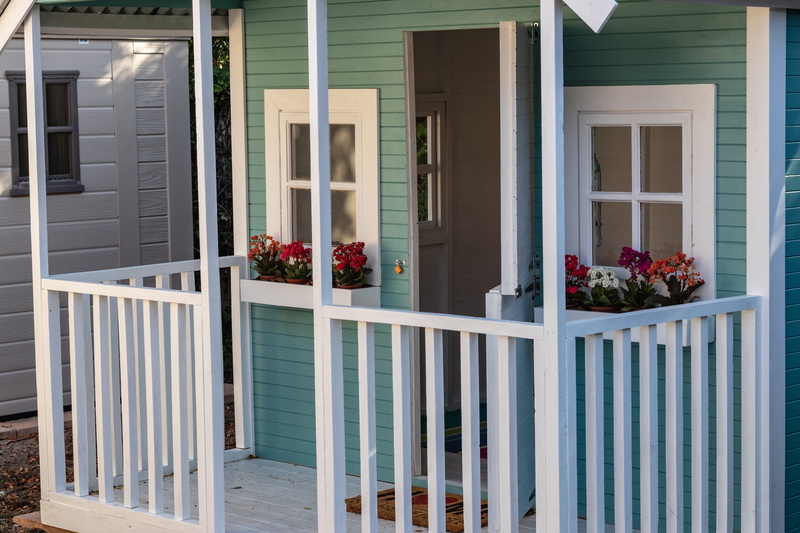 built structure, patio, railing, picket, no people, apparel, plant, day, door, housing, furniture, handrail, outdoors, building exterior, fence, deck, residential district