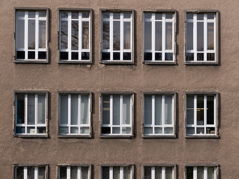 glass - material, reflection, building, window, concrete, brown wall, in a row, shutter, backgrounds, wall, architecture, built structure, window shade