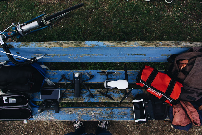 machine, day, blue, mode of transportation, people, black, sport, mavic, apparel, field, watercraft, drone, men, outdoors, land, vest, nature, real people