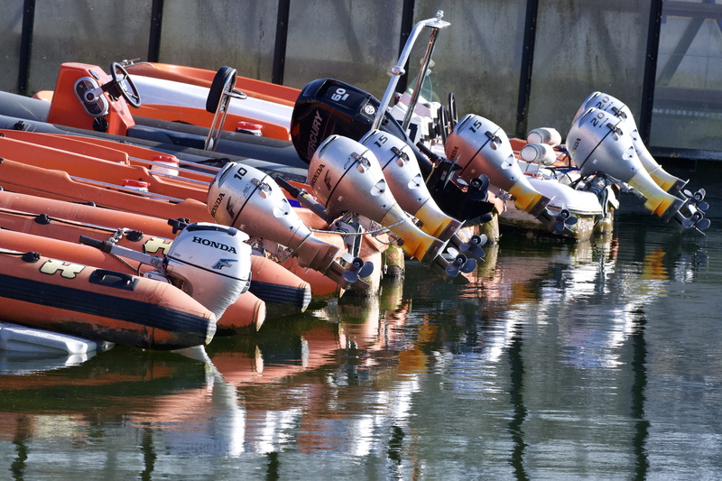 lake, port, vest, activity, apparel, alloy wheel, helmet, aircraft, nature, people, mode of transportation, clothing, reflection, vehicle, technology, competition