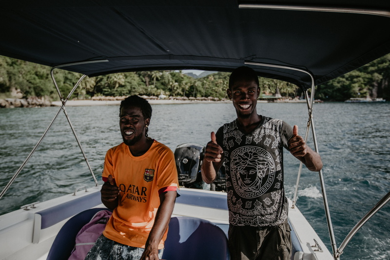 vehicle, lifestyles, sleeve, motorboat, vessel, young adult, water, apparel, outdoors, nautical vessel, travel, watercraft, accessory, lifejacket, smiling