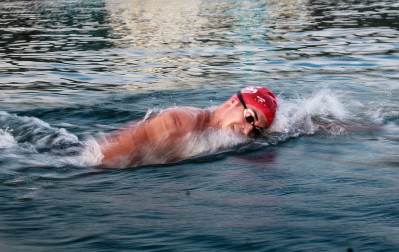 one person, diving, water, man, outdoors, waterfront, mammal, dog, human, diver, bathing cap, day, face, mouth open, body, rippled, apparel, person, lifejacket