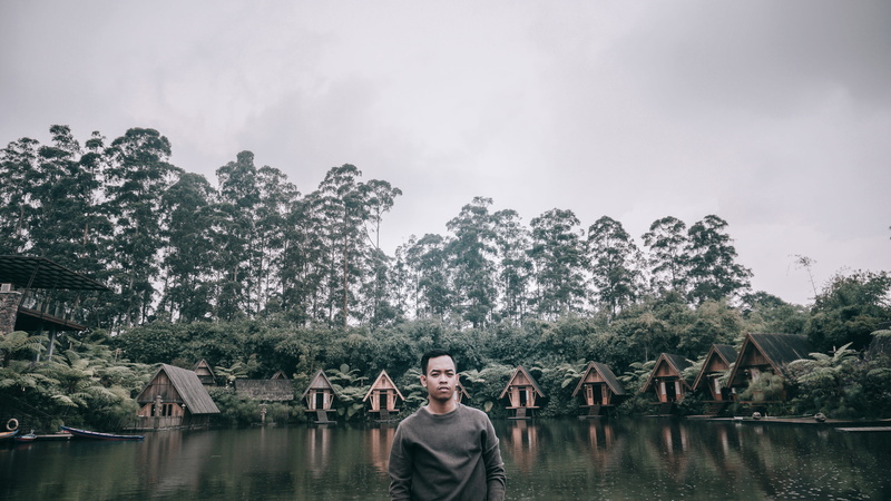 waterfront, architecture, standing, sky, plant, coat, indonesia, cloud - sky, 5K, body, front view, outdoors, tree, face, apparel, one person, portrait
