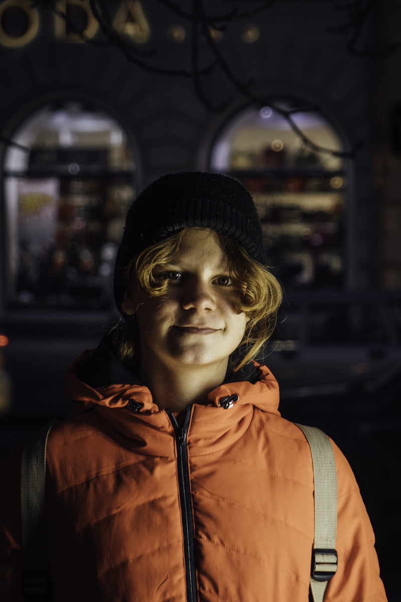 representation, sweatshirt, smiling, one person, 5K, person, hood, hat, night life, cup, close-up, banister, art and craft, lifestyles, focus on foreground