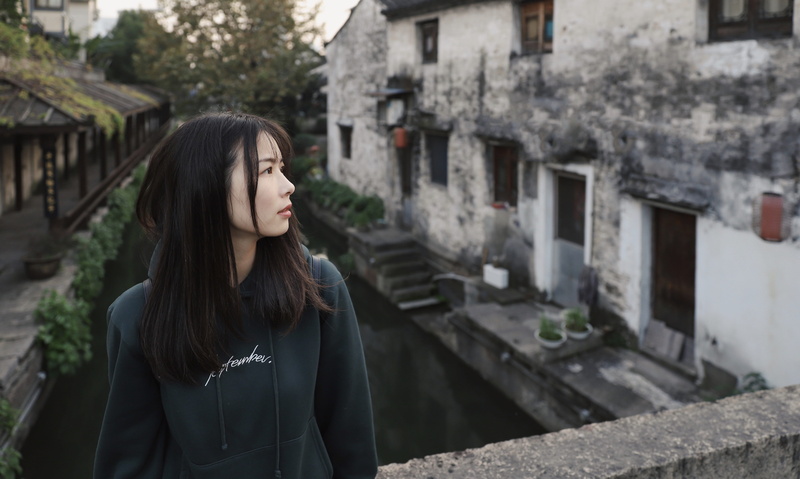sleeve, young adult, clothing, long hair, leisure activity, pants, warm clothing, real people, contemplation, outdoors, sweatshirt, woman, 5K, handrail