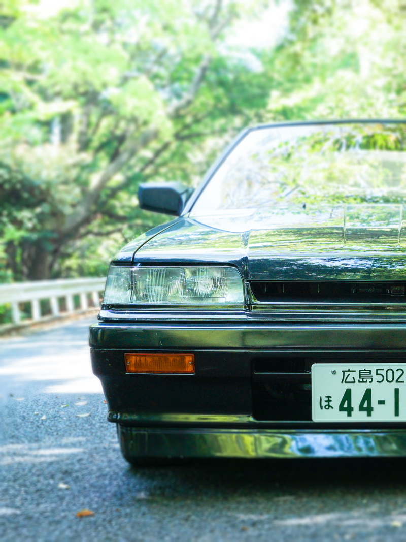 communication, guard rail, no people, sports car, focus on foreground, automobile, mode of transportation, motor vehicle, day, outdoors, text, land vehicle