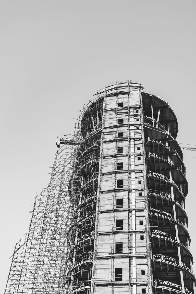 building exterior, antique car, bookcase, construction industry, vehicle, tall - high, construction crane, industry, apartment, apparel, architecture, triangle