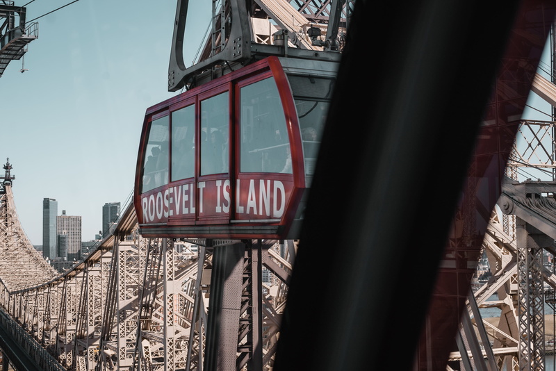 tram, metal, transportation, red, travel, architecture, roller coaster, train track, text, streetcar, roller, building exterior, land vehicle, outdoors