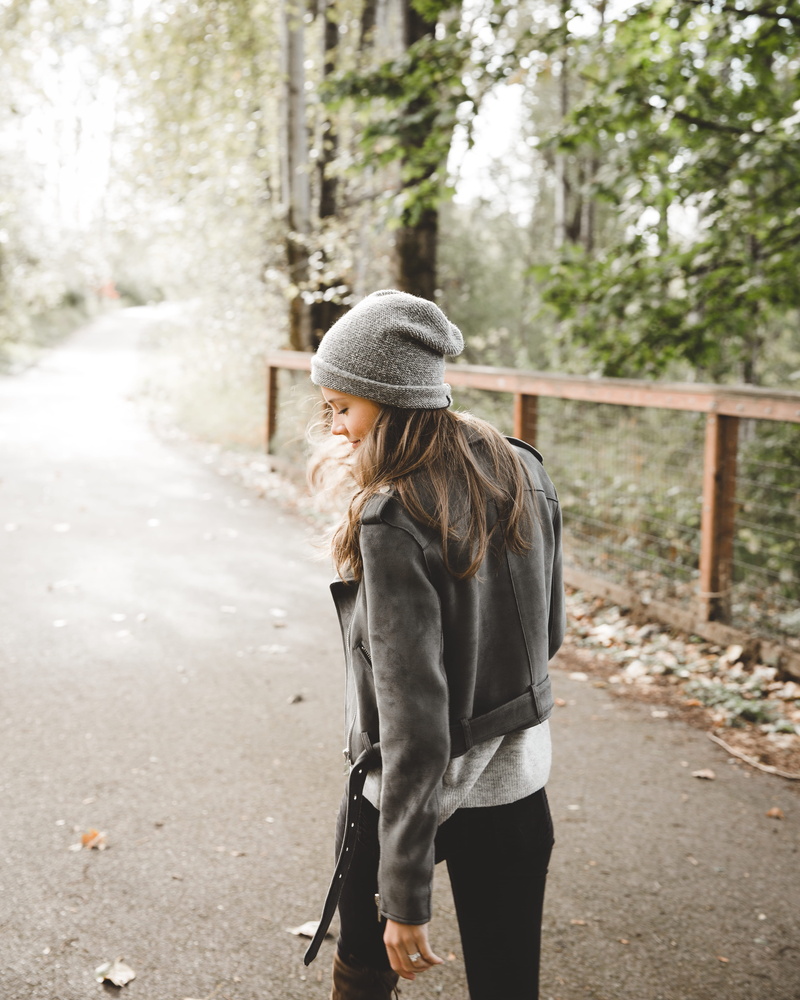 standing, hairstyle, casual clothing, hat, 4K, young adult, leisure activity, focus on foreground, woods, woman, face, three quarter length, warm clothing