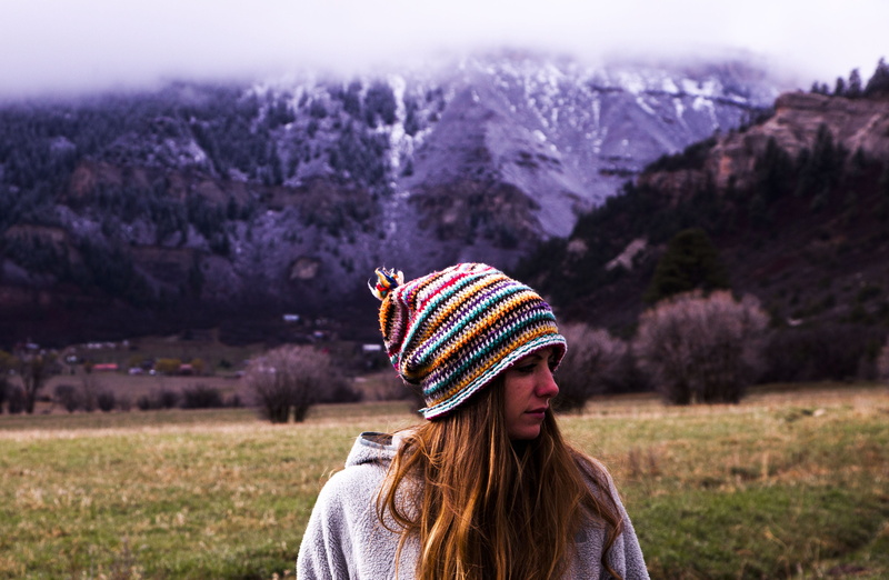 blur, focus on foreground, young adult, trees, contemplation, field, knit hat, nature, bonnet, winter, long hair, warm clothing, hairstyle, outdoors, freedom