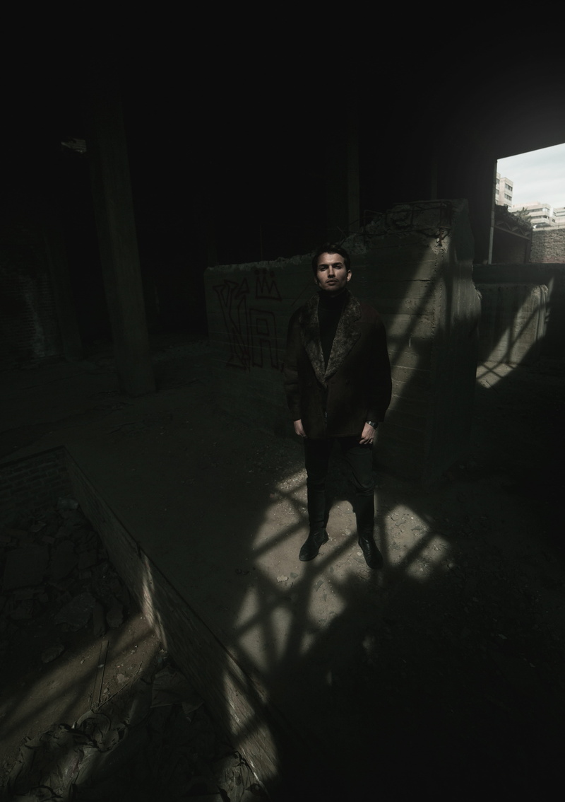 inside, silhouette, young men, indoors, shoe, person, daytime, one person, human, front view, man, dark, city, cinema, 5K, night, looking at camera, architecture