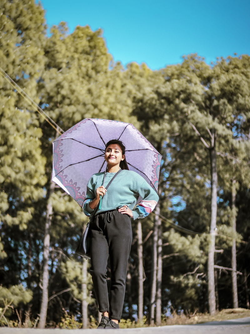 shoe, 5K, plant, front view, footwear, one person, outdoors, full length, smiling, umbrella, land, sleeved, countryside, teal, apparel, shelter, day, vegetation