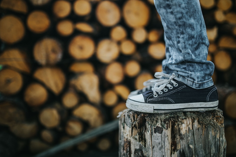 4K, teen, nature, leisure activity, wood - Material, one person, human foot, male, human leg, focus on foreground, day, wood, log, casual clothing, real people