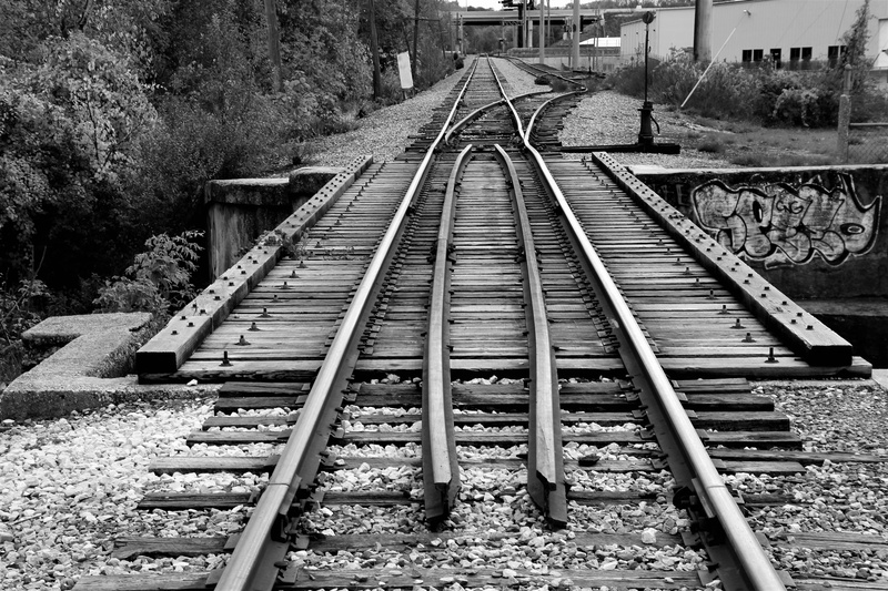 rail transportation, photograph, outdoors, connection, 5K, greyscale, railway, gravel, vanishing point, built structure, nature, transportation, metal