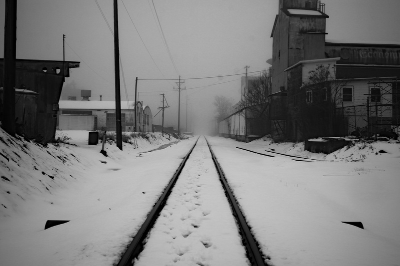 electricity, outdoors, covering, nature, road, winter, train track, train tracks, rail transportation, built structure, white color, snow, no people, architecture