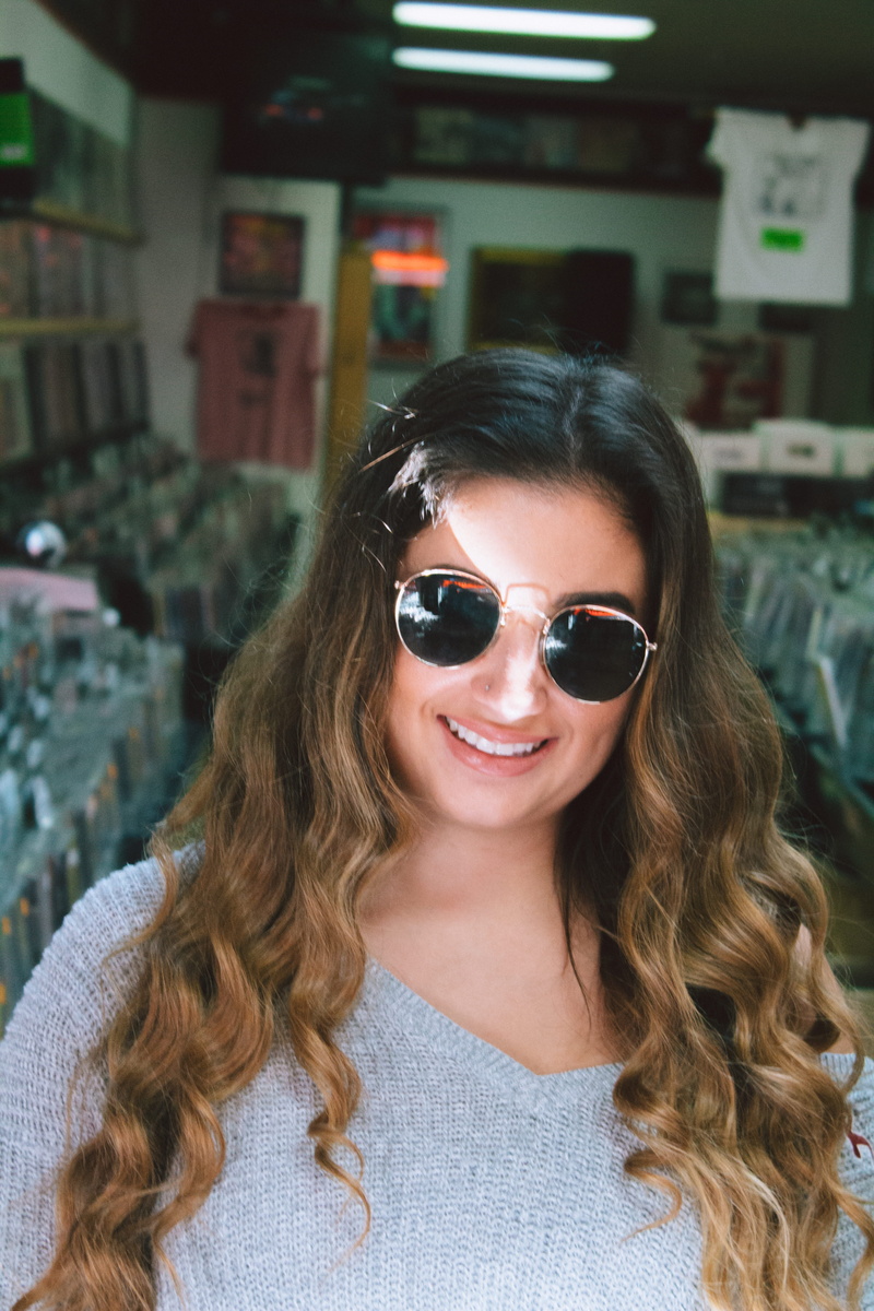 sunglasses, shopping, smiling, clothing, model, front view, looking at camera, hair, real people, long hair, young adult, beatles, women, headshot, record