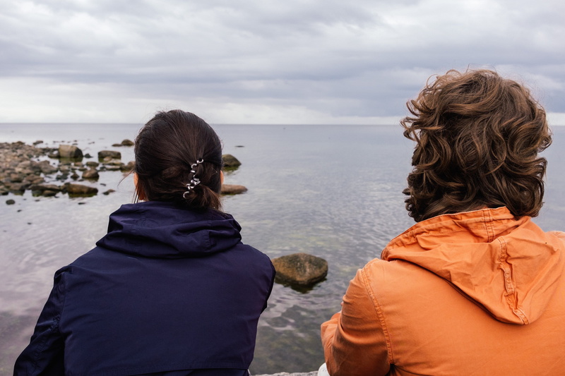 enjoying, female, two, adult, people, lifestyle, land, conversation, casual, adventure, hood, horizon over water, leisure activity, together, sea, raincoat