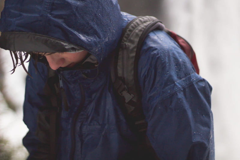 wearing, focus on foreground, wet, front view, raincoat, warm clothing, backpack, walking, jacket, winter, midsection, low, adult, casual clothing, snow