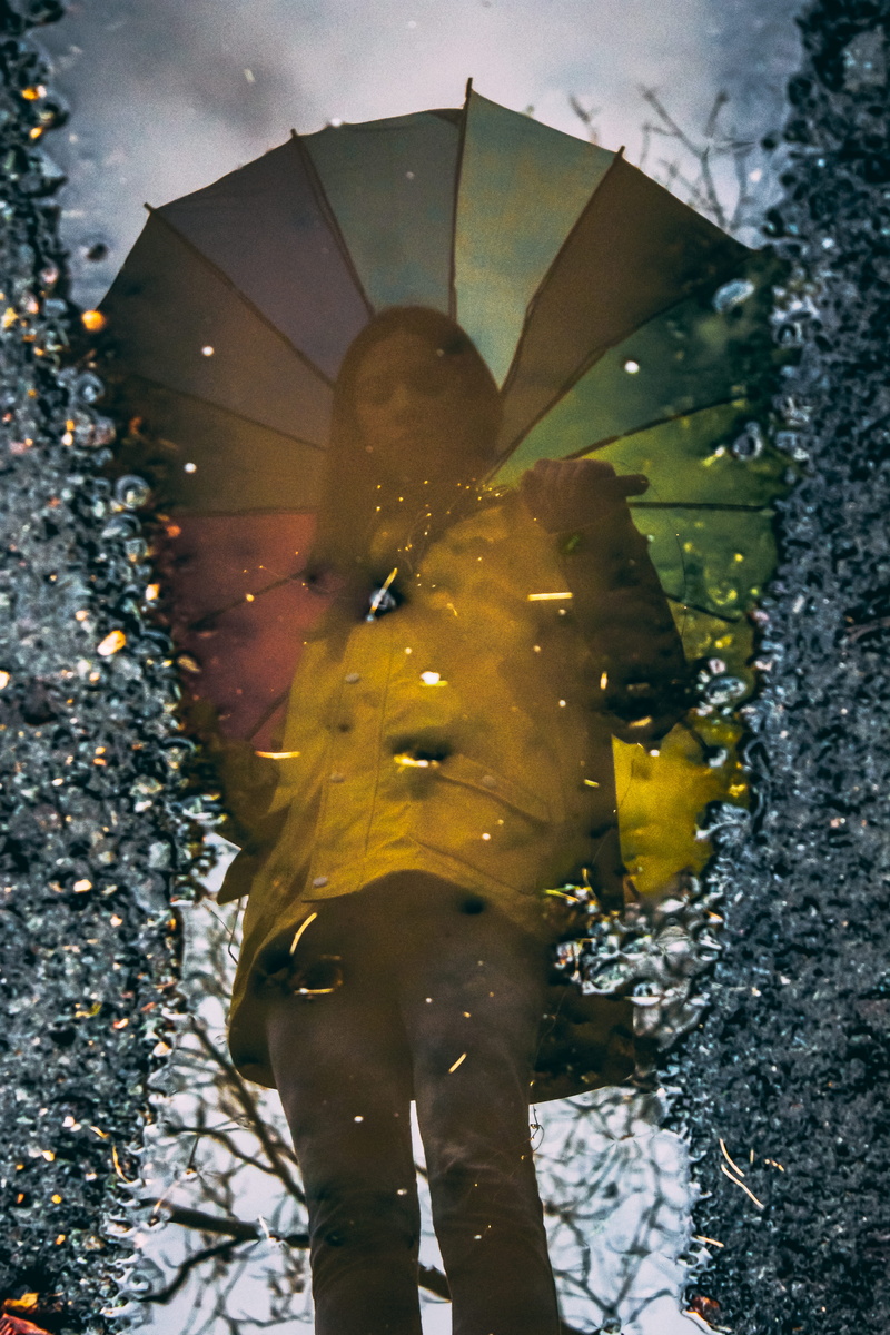 yellow, real people, low section, close-up, glossy, lifestyles, reflected, raincoat, daytime, rain, standing, leaf, umbrella, outdoors, woman, reflection