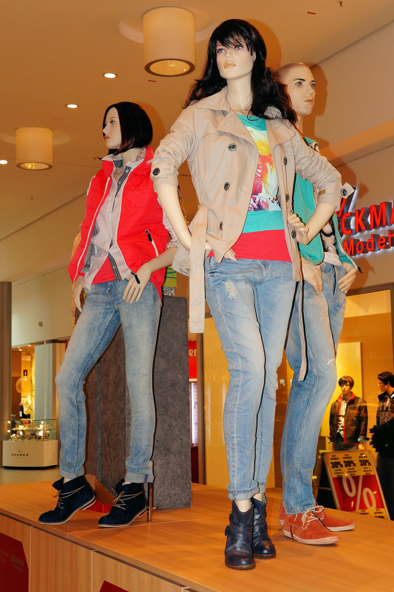 illuminated, shopping, pants, standing, real people, fashionable, indoors, young women, consumerism, lifestyles, women, clothing, jeans, casual clothing
