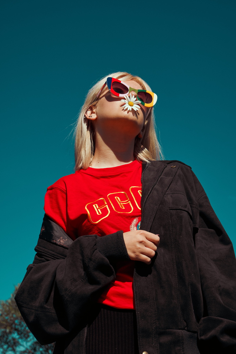 color, hair, vibrant, standing, conceptual, hairstyle, mouth, young, outdoor, low, waist up, daytime, sunglasses, wearing, jacket, pop, sunlight, lady