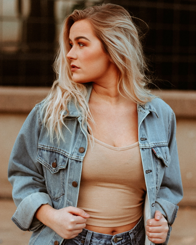 wearing, hear, young women, long hair, jean, person, modeling, focus on foreground, one person, portrait, female, holding, indoors, casual clothing, denim