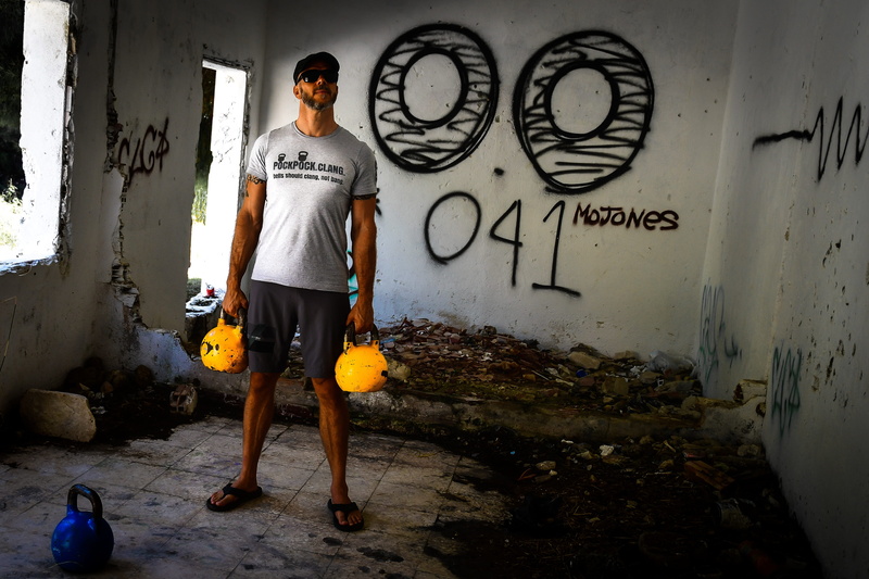 kettlebell training, crossfit, art and craft, glasses, kettlebell man, young adult, text, wall - building feature, day, standing, architecture, kettlebells
