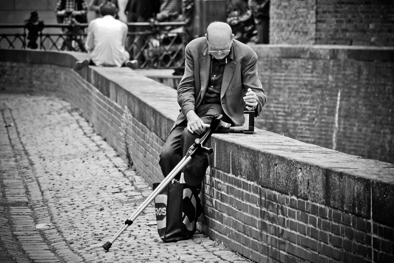 streetscape, beer, rear view, city, adult, human, old town, road, focus on foreground, street, drink, architecture, full length, leisure activity, alcohol