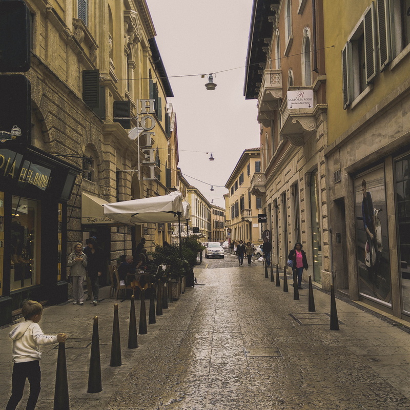 style, real people, outdoors, streets, sky, day, people, building, built structure, direction, transportation, lifestyles, footpath, italy, verona, cars