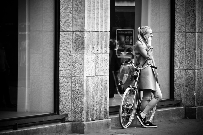 building exterior, pavement, break, people, street photography, communication, urban art, urban, adult, scene, wall - building feature, side view, sunlight