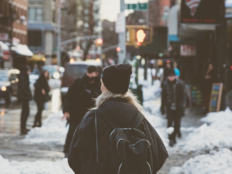 outdoors, city, city street, standing, beside, street light, warm clothing, building exterior, 5K, cold temperature, street, new york, walking, one person