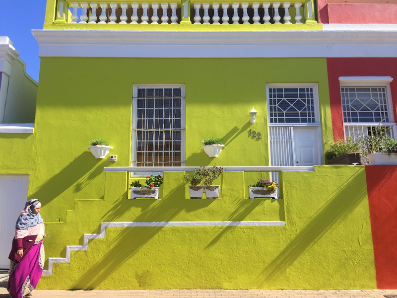 people, building exterior, green, hosue, house, shadow, nature, yellow, woman, portrait, colourful, colorful, built structure, outdoors, door, window, steps