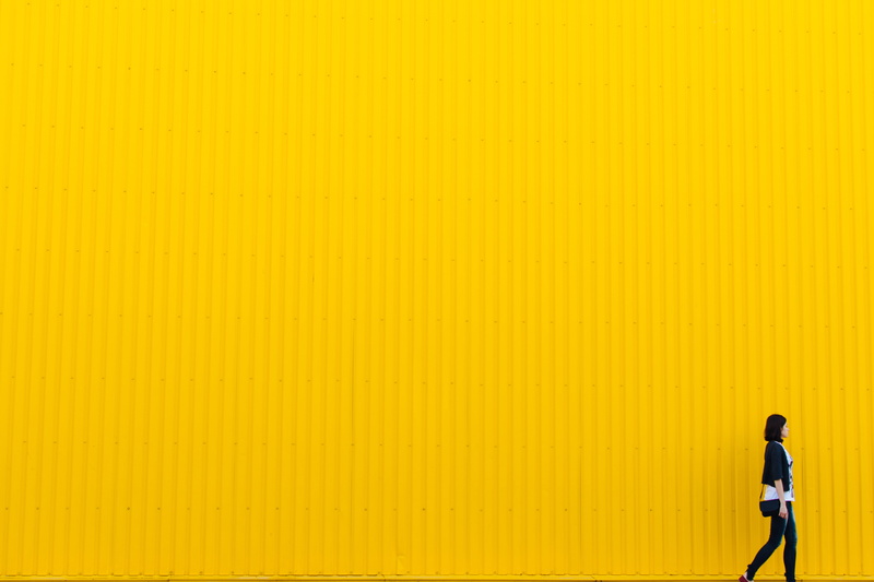 wall, one man only, 5K, lifestyles, real people, copy space, walking, side view, built structure, leisure activity, day, adults only, adult, woman, building