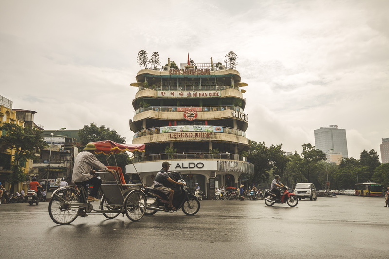 asia, bike, real people, day, street, city, building, people, hanoi, tourism, riding, sky, trike, city life, land vehicle, outdoors, bicycle, exotic, town