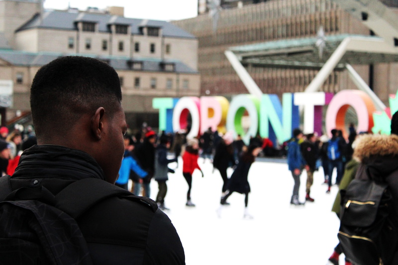decoration, shift, sign, backpack, ice rink, skating, group of people, lens, architecture, freestanding, crowd, near, real people, decor, Toronto, word