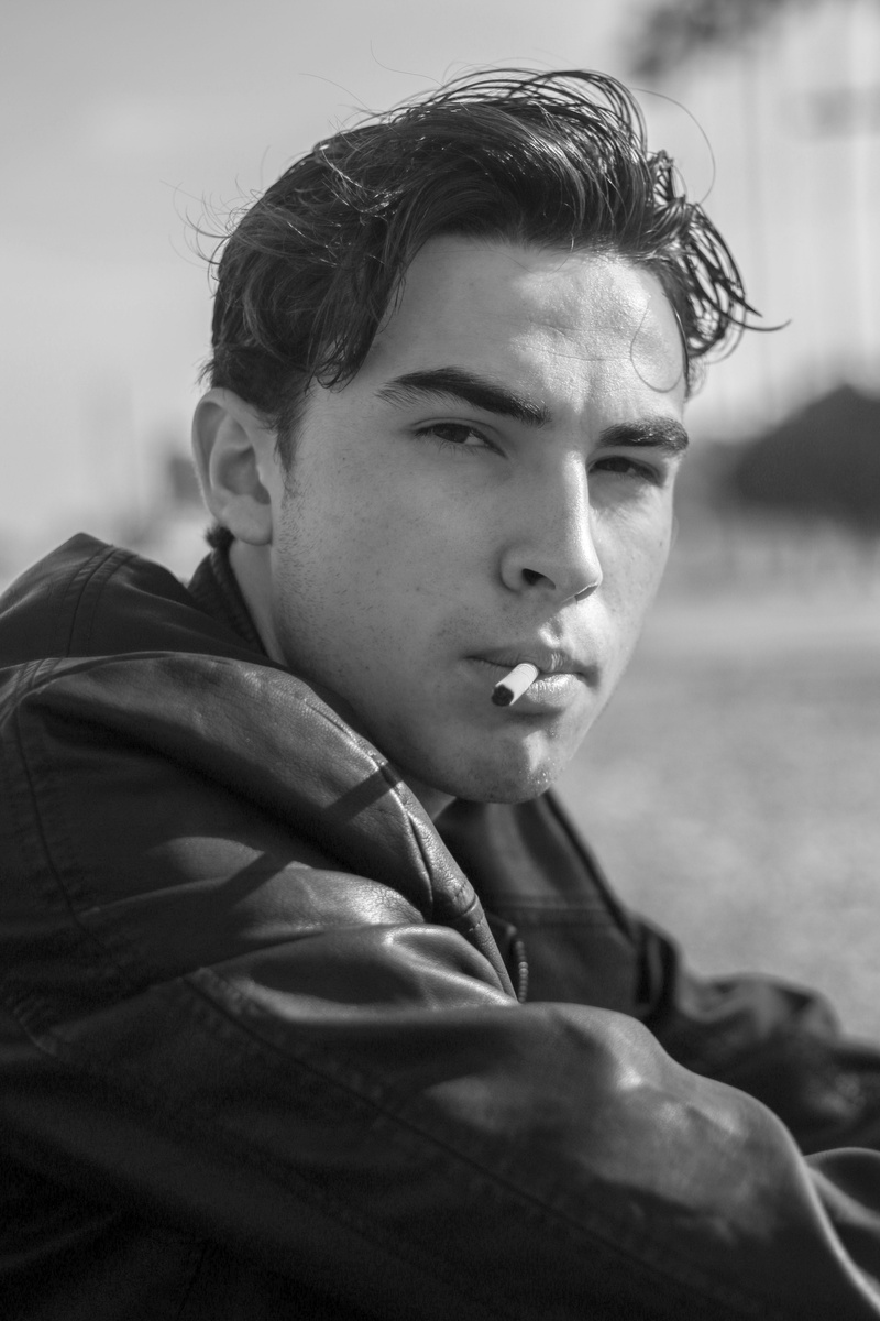 teenage boys, real people, casual clothing, looking, close-up, cigarrette, old town gilbert, focus on foreground, black and white, young adult, looking at camera