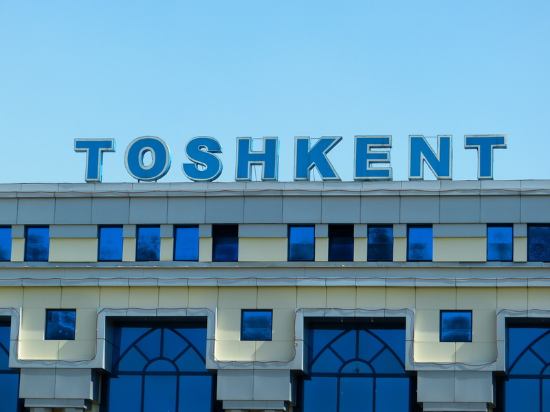 communication, sky, building Exterior, sign, arrive, city, glass - material, capital letter, text, 4K, architecture, uzbekistan, blue, day, western script