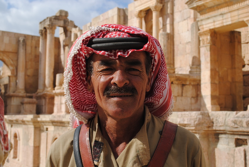 keffiyeh, beard, one person, facial hair, stone, 4K, built structure, man, headshot, male, wearing, lifestyles, portrait, focus on foreground, badawi