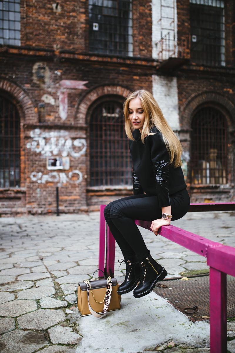 young, leather, architecture, adult, blond, street, female, outdoors, full length, day, pretty, style, sitting, building exterior, hairstyle, real people