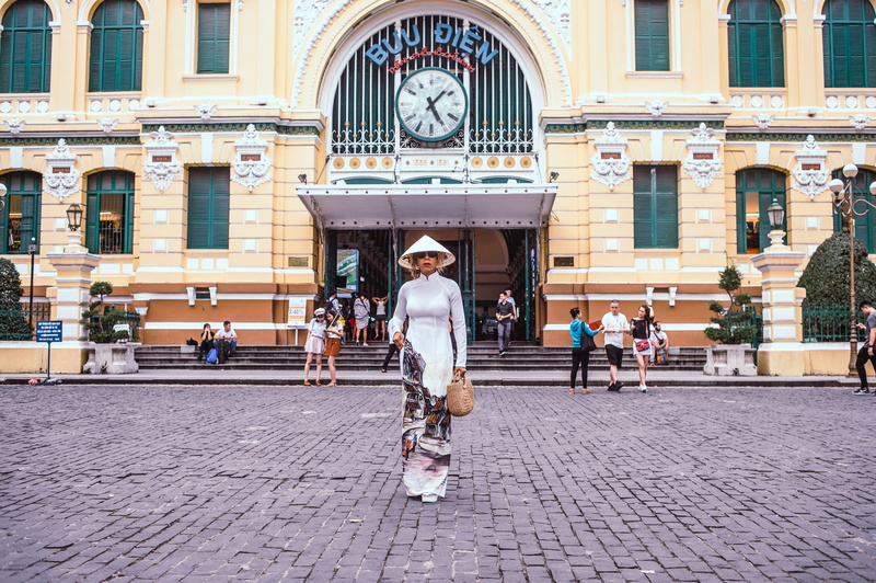 footpath, building, architecture, front, incidental people, women, vietnam, full length, cobblestone, paving stone, city, standing, town, real people, adult