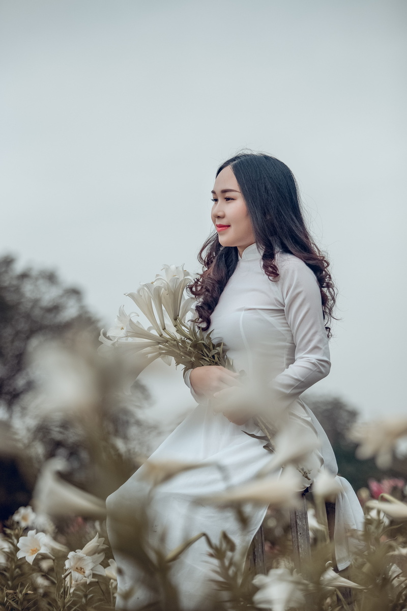 person, hair, white dress, field, beauty, beautiful, selective focus, pose, wearing, sleeved, park, pretty, young adult, plants, side view, dress, flowers