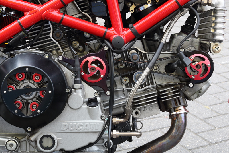 day, red, bike, clutch, bicycle, close-up, equipment, transportation, connection, distribution, outdoors, technology, ducati, motorcycle, machinery, high angle view