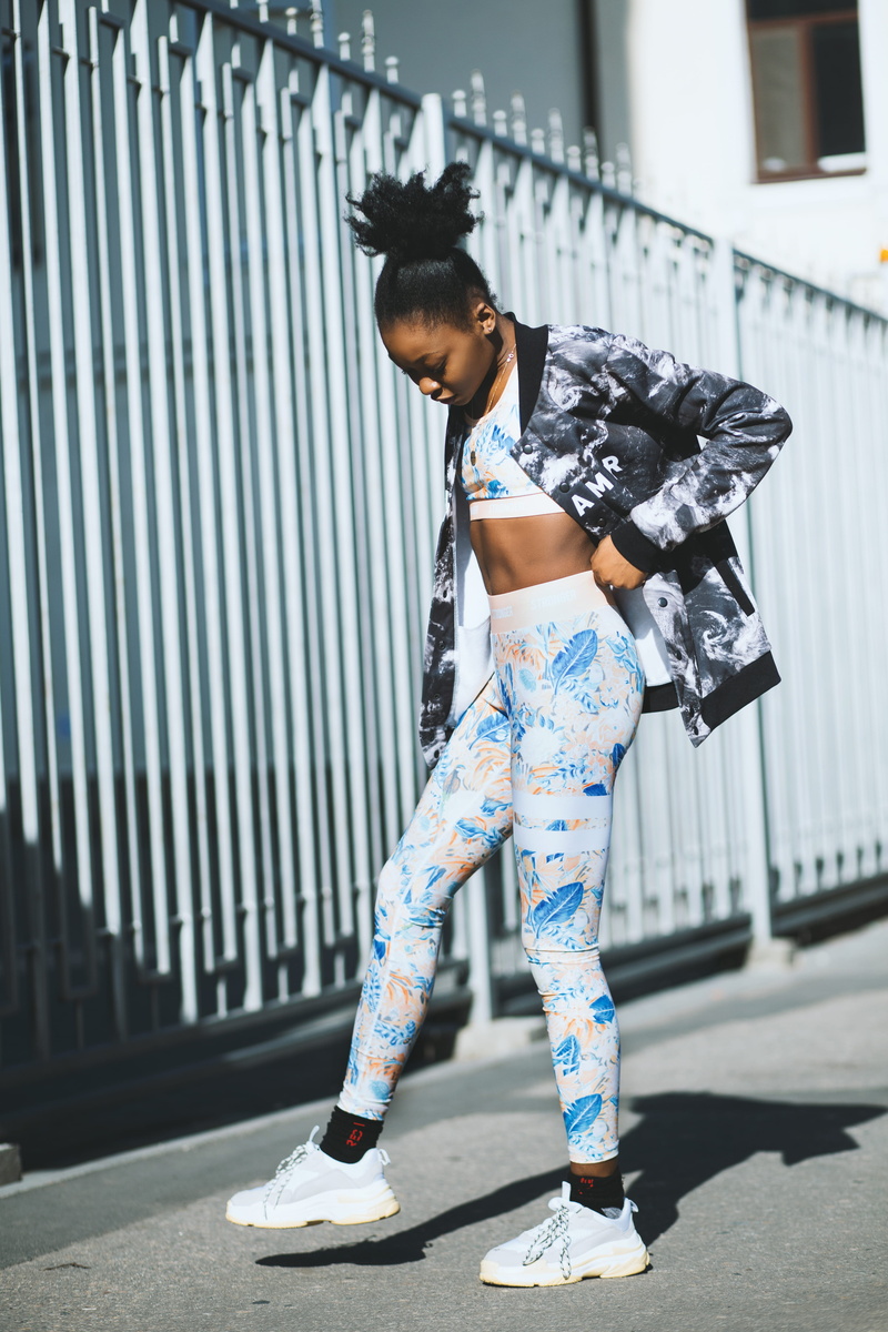 black skin, blogger, built structure, sportswear, real people, front view, metal, fitwear, daytime, blog, city, one person, young women, leisure activity