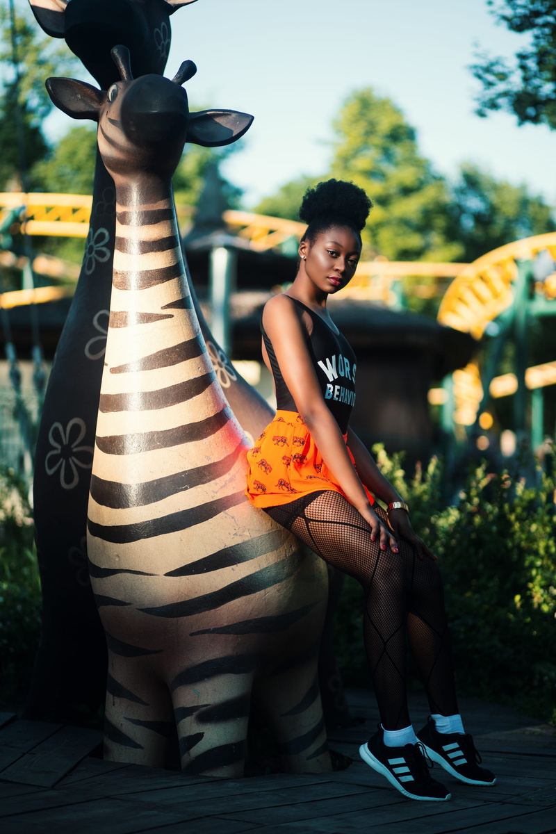 blogger, lifestyles, focus, beautiful woman, black, hairstyle, shoes, real people, beautiful, statue, women, legs, recreation, blur, outdoors, fashion model