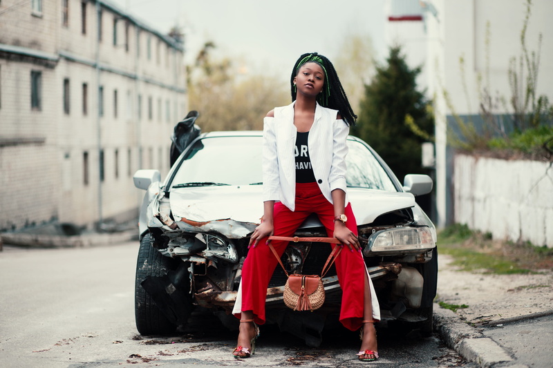 blogging, focus on foreground, sitting, person, transportation system, street, asphalt, automobile, full length, young, women, pose, nigerian, portrait