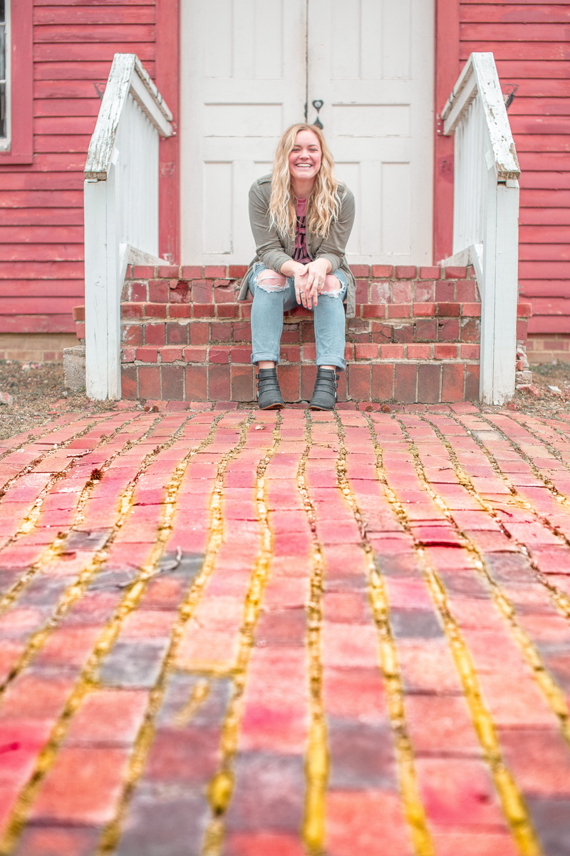 blonde, girl, beautiful woman, built structure, blogger, architecture, 5K, smiling, brick, red brick, style, adult, red, emotion, hair, real people, sitting