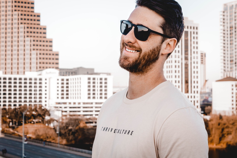 focus on foreground, hot guy, headshot, cute guy, man, office building exterior, 5K, lifestyle, men, portrait, smiling, casual clothing, beard, outdoors