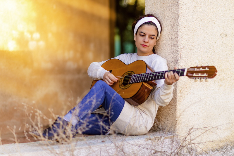 leisure activity, guitarist, one woman only, adolescence, relaxation, acoustic guitar, i am a student, young adult, string instrument, girl, play guitar