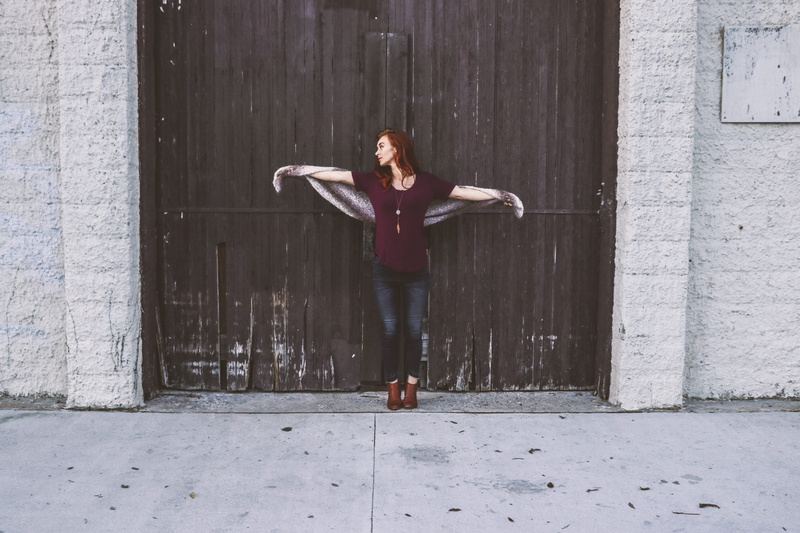 wooden, mid-air, wood, lifestyle, daylight, person, outfit, brown, photoshoot, arms outstretched, boots, blue jeans, front view, jeans, model, limb, day